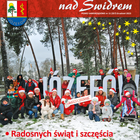 Grupa osób pozuje do zdjęcia na tle napisu 